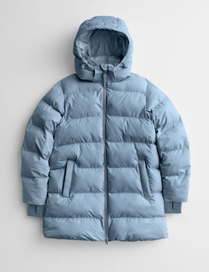 Blue puffer jacket on a light gray background. 