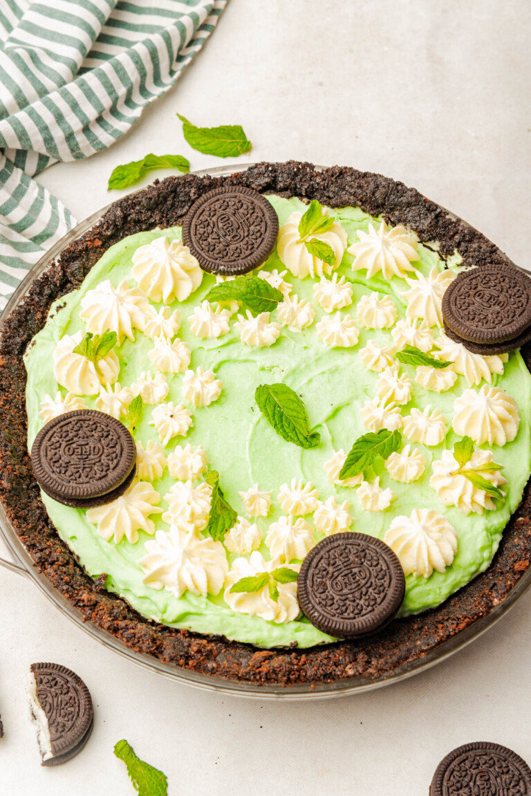 Grasshopper pie in a pie dish with decorations on top.