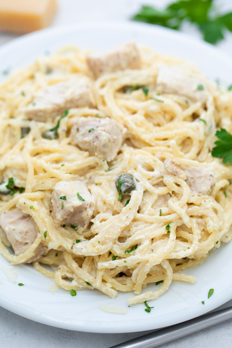 a serving of instant pot chicken alfredo in a white plate