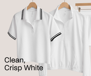 Two white shirts with black trim on hangers against a light background.